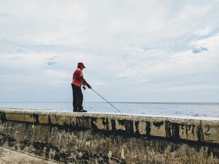 Fishing man Cuba at Malecon