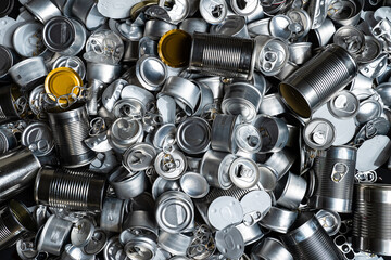 Metal tins, cans and jar garbage from household on the table. City home trash made of aluminum....