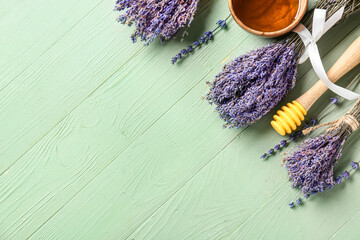 Obraz na płótnie Canvas Lavender flowers with honey on wooden background