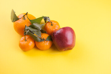 Orange fruit withleaves isolated on white background.
