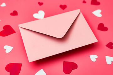 Love letter. Pink envelope on a red background with hearts.