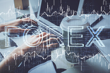 Double exposure of woman hands typing on computer and forex chart hologram drawing. Stock market invest concept.