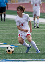 Young athletic boy making exciting plays during a soccer game