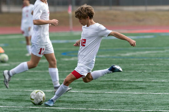 Young athletic boy making exciting plays during a soccer game