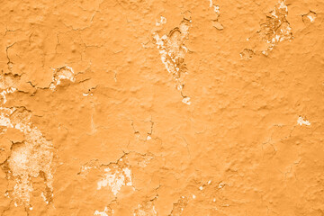Concrete marigold yellow colorful wall surface texture. Abstract grunge bright orange color 2021 background with aging effect. Copyspace.