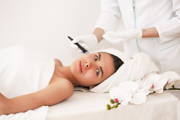 The concept of health, beauty, spa and leisure - beautiful woman and spa receiving massage