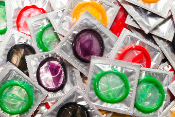 Colorful condoms background.
