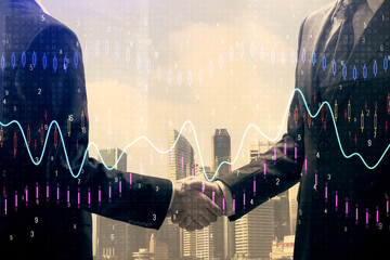 Double exposure of forex graph hologram and handshake of two men. Stock market concept.