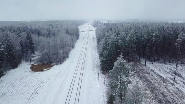 Winter forest nature snow-covered winter trees landscape early morning aerial view, railway tracks, railway. recreation travel and tourism frosty treetops bright colors aerial photography
