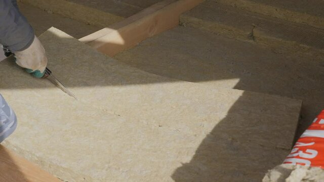 Construction work. Installation of insulation using.