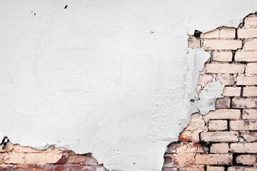White Plaster Covered Brick Wall With Huge Crack. Old Stonewall Damaged Stucco. 