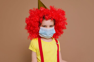Medical mask on a clown girl. Ban on celebrations and performances. There will be no April 1.