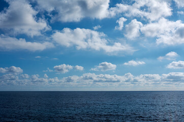 Naklejka na ściany i meble gorgeous, blue sky with fluffy clouds, textures copy space background
