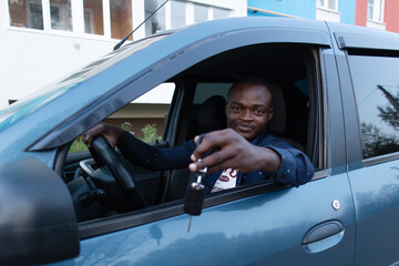 Happy African American with car key © Alexander