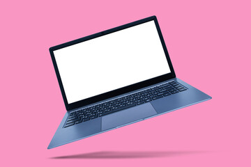 Slim modern laptop with white screen mockup on pink background with shadow.