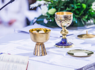 altar with host and chalice with wine in the churches of the pope of rome, francesco