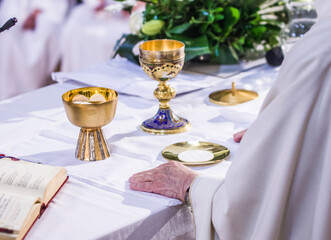 altar with host and chalice with wine in the churches of the pope of rome, francesco