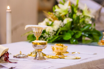 altar with host and chalice with wine in the churches of the pope of rome, francesco