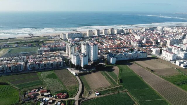 Drone Aerial view over Costa da Caparica town and seascape in Portugal