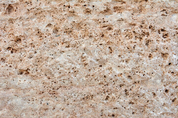 Textured stone, sandstone, limestone surface. Close image. Stone, natural abstract texture for backgrounds. Close up. Wallpaper, architecture.