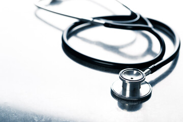 Black stethoscope for doctor diagnostic coronavirus disease, medical tool for health on blue...