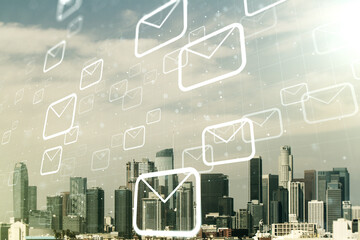 Double exposure of abstract virtual postal envelopes hologram on Los Angeles city skyscrapers background. Electronic mail and spam concept