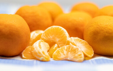 Detail of Tangerines in the foreground ready to eat