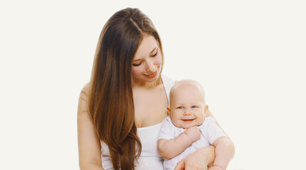 Portrait of happy smiling mother and baby playing together over a white background