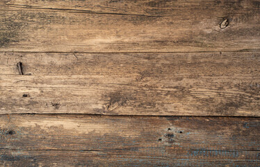 The background is made of natural aged wood. With space to copy. The concept of backgrounds.