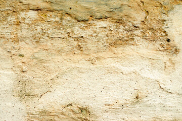 Texture of a concrete wall with cracks and scratches which can be used as a background