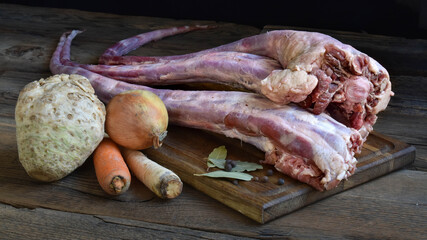 Raw oxtail with celery root, onions and carrots