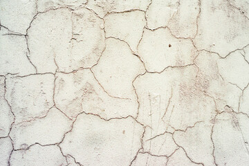Texture of a concrete wall with cracks and scratches which can be used as a background
