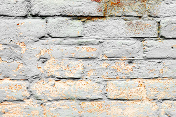 Texture of a brick wall with cracks and scratches which can be used as a background
