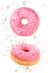 Vertical composition of delicious doughnuts decorated with pink chocolate icing and sugar sprinkles...