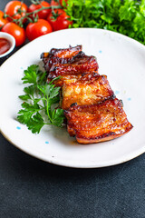 ribs meat pieces on the bone and lard fat grilled BBQ sauce second course snack ready to eat on the table meal top view copy space for text food background rustic image