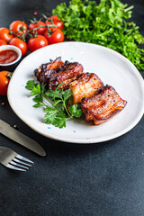 ribs meat pieces on the bone and lard fat grilled BBQ sauce second course snack ready to eat on the table meal top view copy space for text food background rustic image