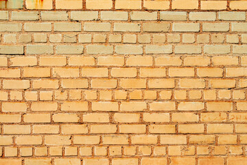 Texture of a brick wall with cracks and scratches which can be used as a background