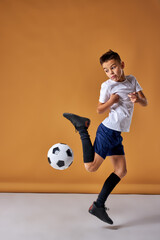 Fototapeta na wymiar boy playing soccer, happy child, young male teenager enjoying sports game, isolated portrait, kids activities, little soccer player