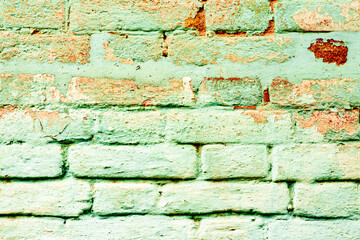 Texture of a brick wall with cracks and scratches which can be used as a background