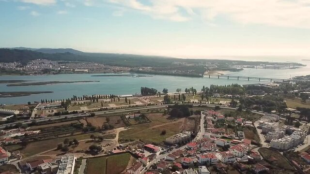 view of the city Viana do Castelo Portugal look from above drone shot aerial birds eye Lima Limia river Atlantic ocean sunny day bridge sideways pan 
