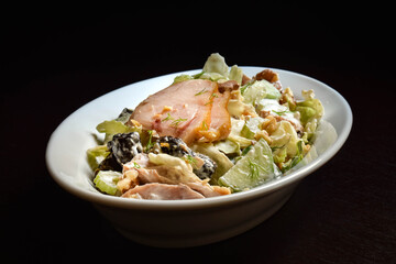 Salad with smoked chicken breast, walnuts and prunes
