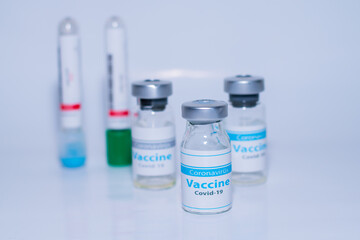A single bottle vial of Covid-19 coronavirus vaccine in a research medical lab. 