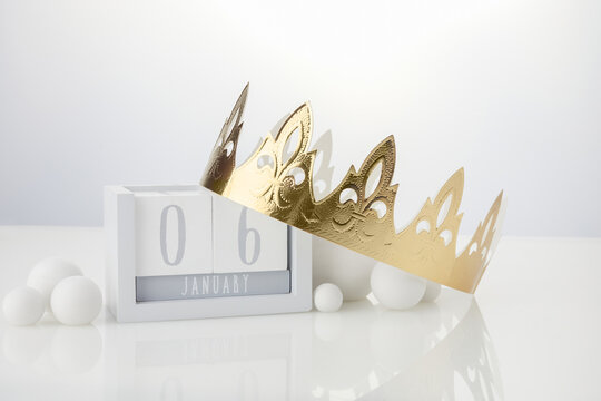 Happy Epiphany day, three kings day. Calendar with king crown on white background