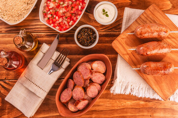 Brazilian pork sausage portion with chimichurri - Top view