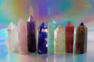 Healing Chakra crystals on halographic background. Meditation, Reiki or spiritual healing...