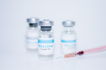 A single bottle vial of Covid-19 coronavirus vaccine in a research medical lab. 