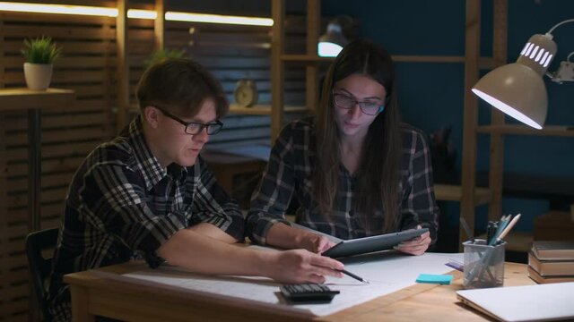 Creative Business Team, Business Project, Hipster Businessmen, Remote Work, Freelance Working. Hipster Man and woman working on business project using tablet