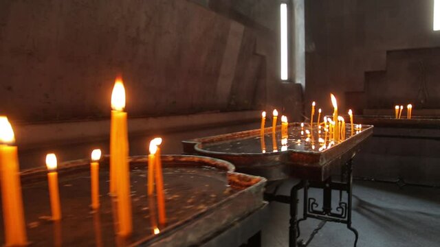 Dynamic ronin shot of candles in baptisterium
