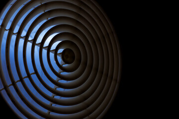 Obraz premium ventilation grill diffuser close-up mounted in the duct at night, the front and background are blurred