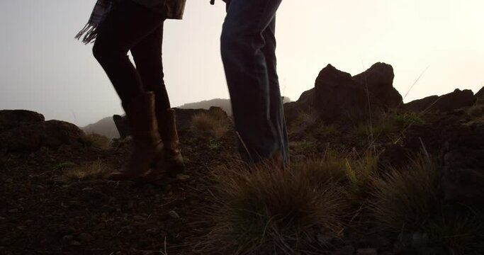 Couple walking side by side on top of Haleakala Crater
